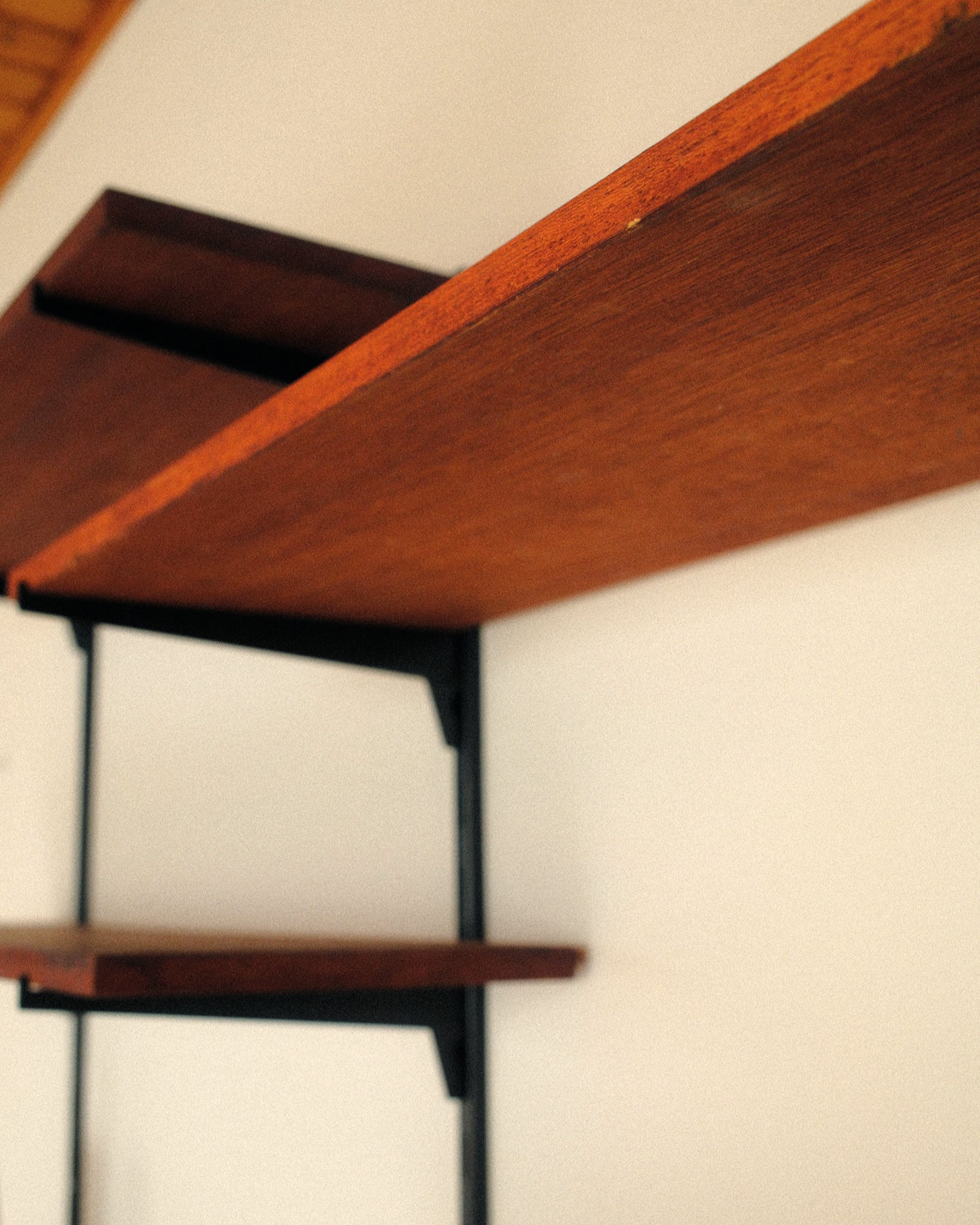 Modular wall unit, teak veneer shelves and black metal uprights