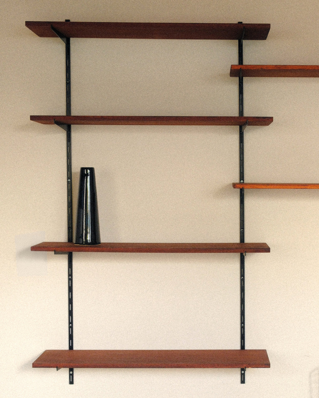 Modular wall unit, teak veneer shelves and black metal uprights