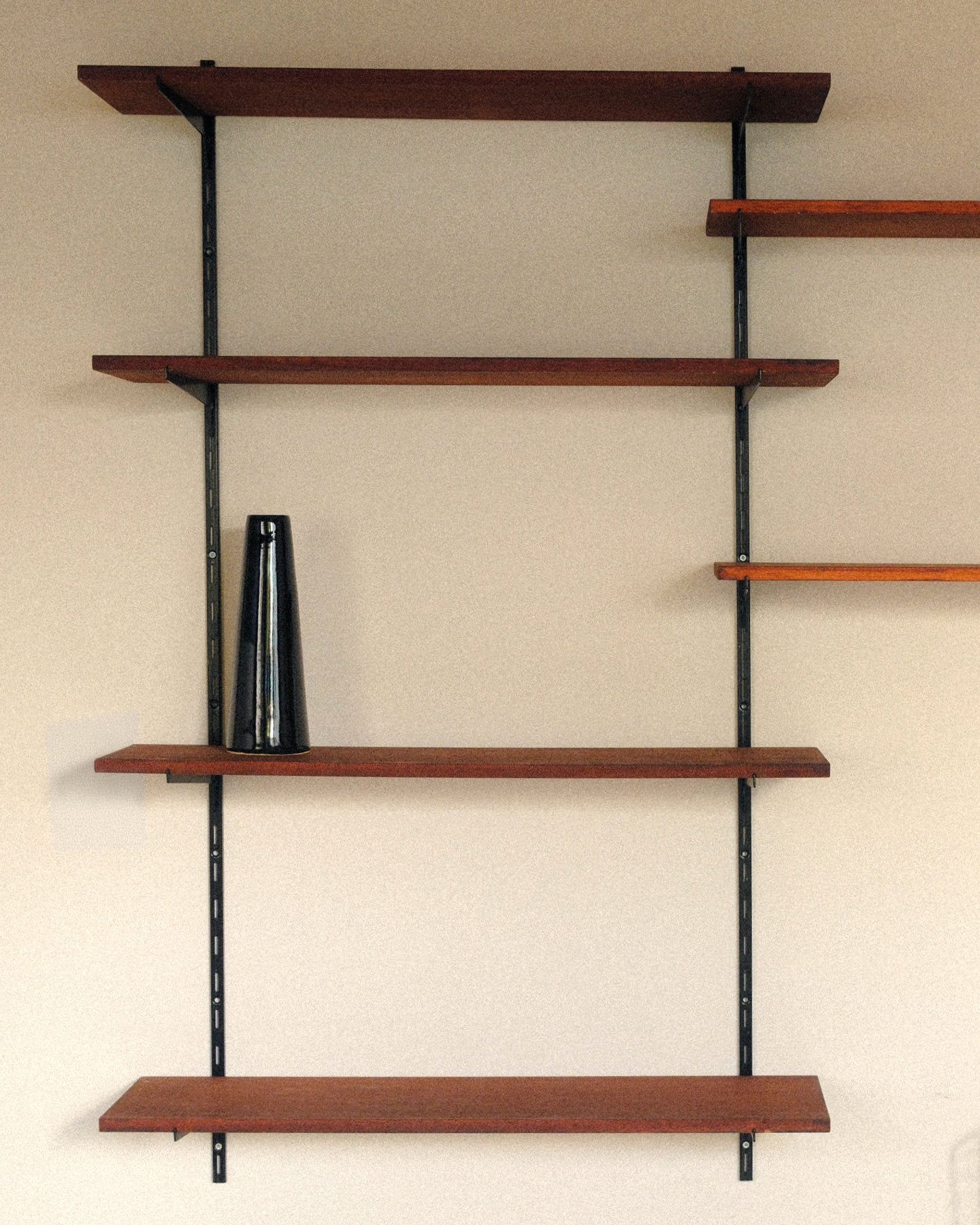 Modular wall unit, teak veneer shelves and black metal uprights