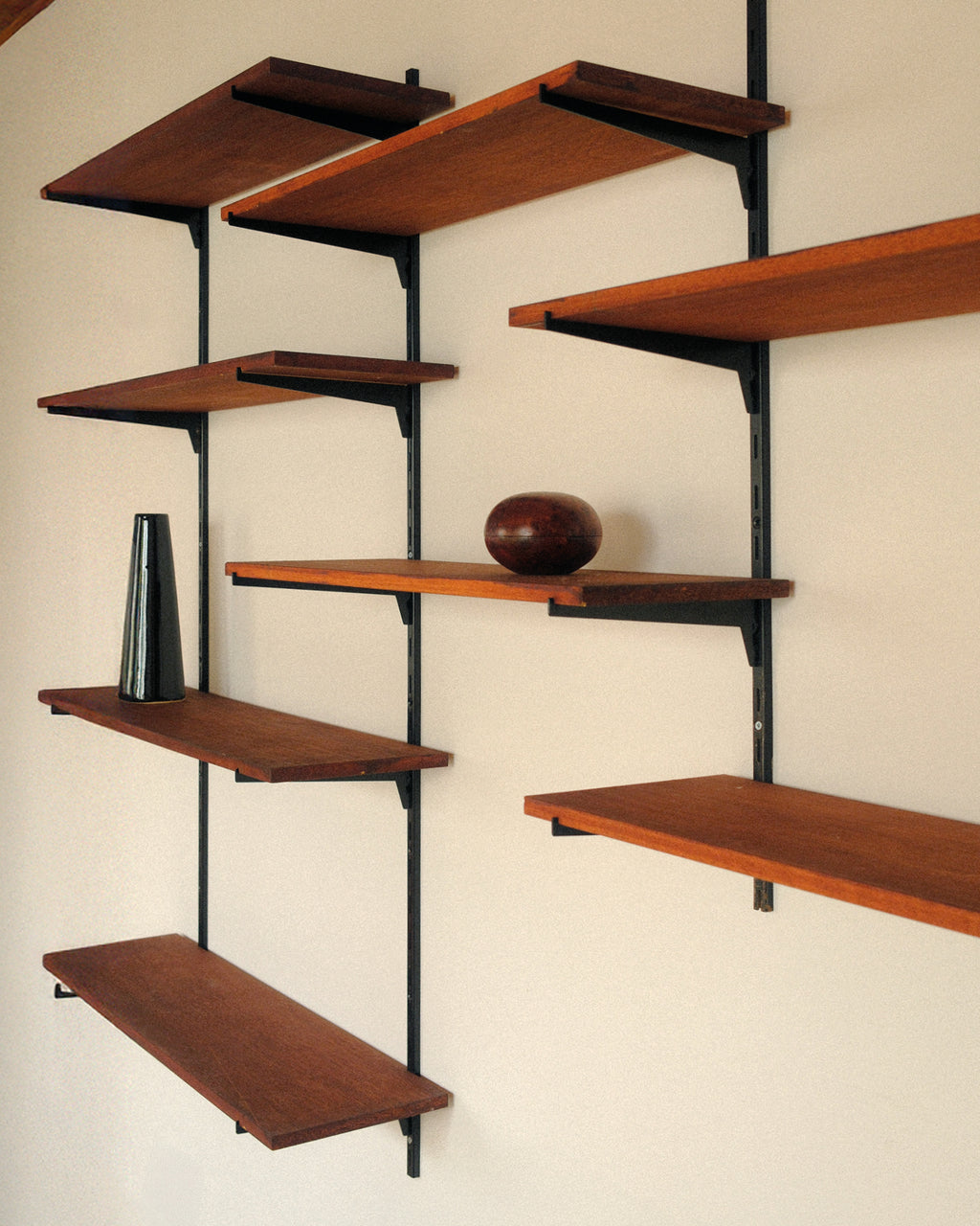 Modular wall unit, teak veneer shelves and black metal uprights