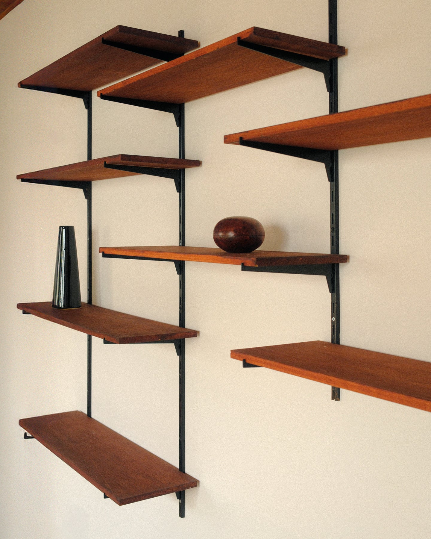 Modular wall unit, teak veneer shelves and black metal uprights
