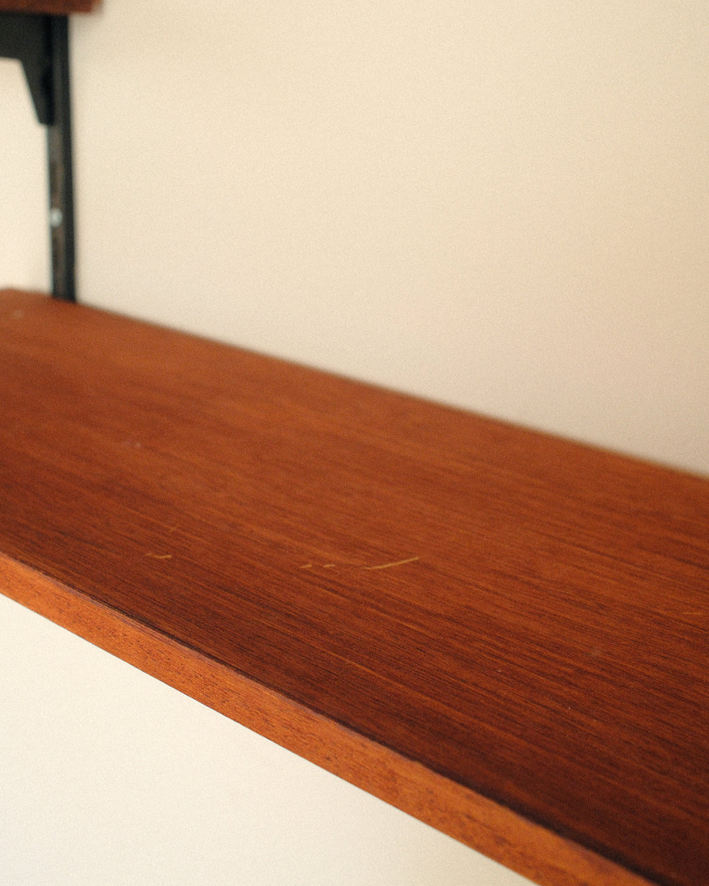 Modular wall unit, teak veneer shelves and black metal uprights