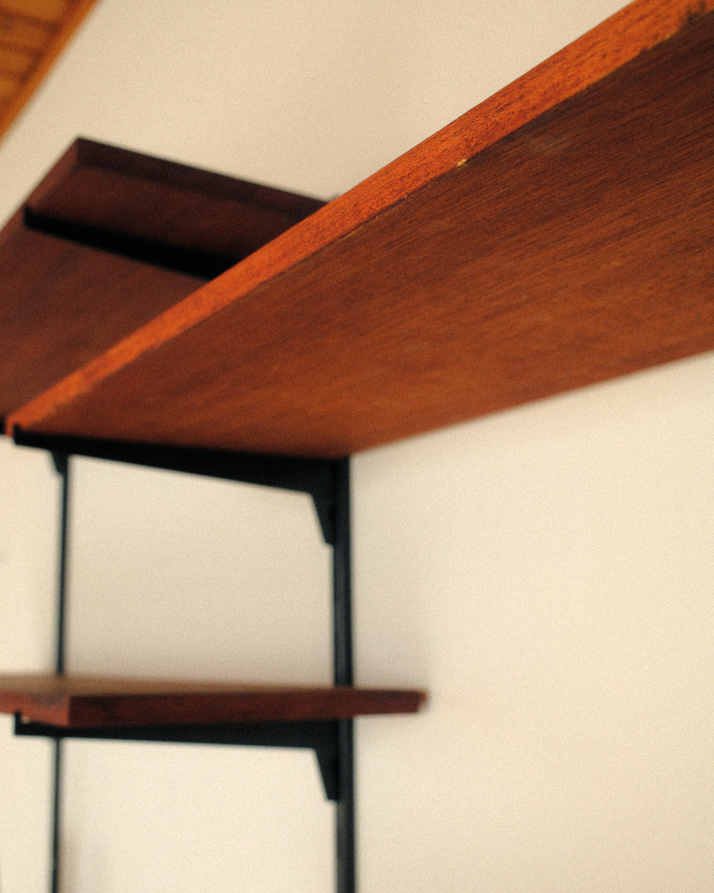 Modular wall unit, teak veneer shelves and black metal uprights