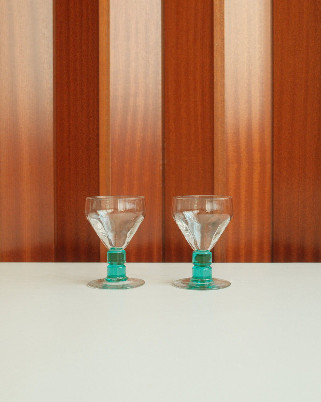 Two glasses with turquoise stems