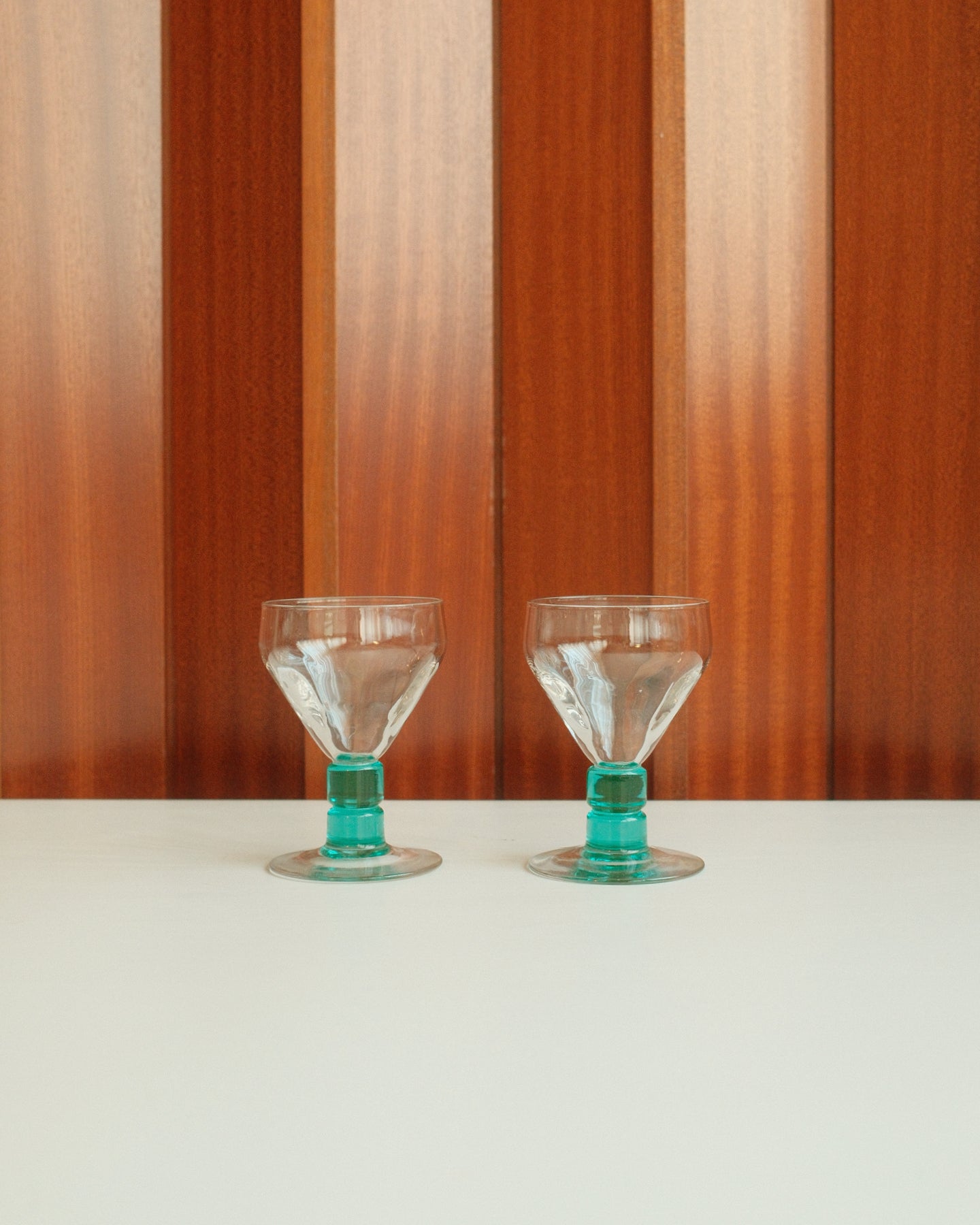 Two glasses with turquoise stems