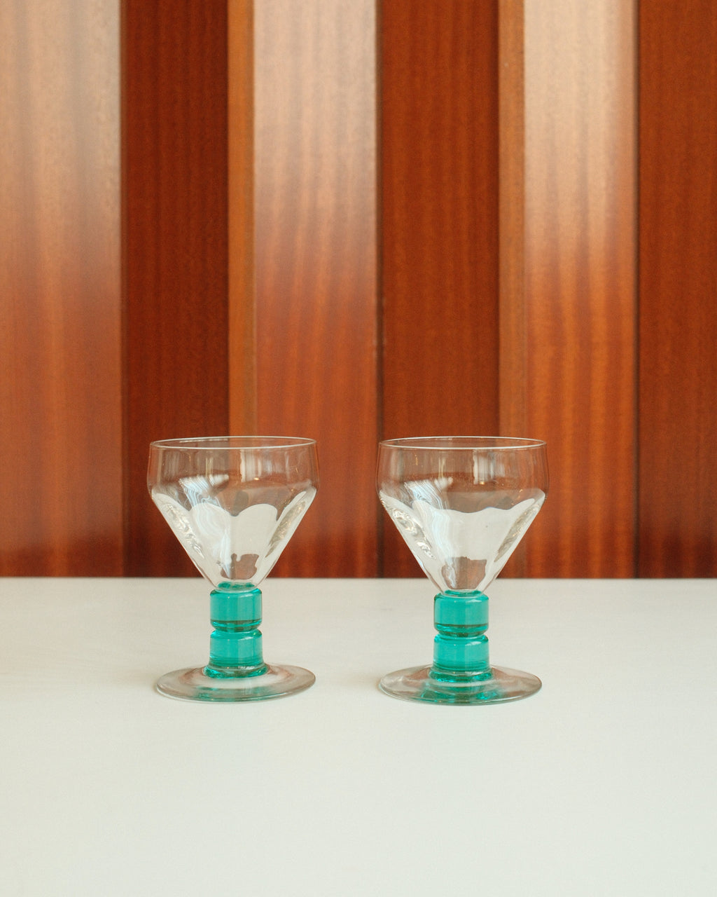 Two glasses with turquoise stems