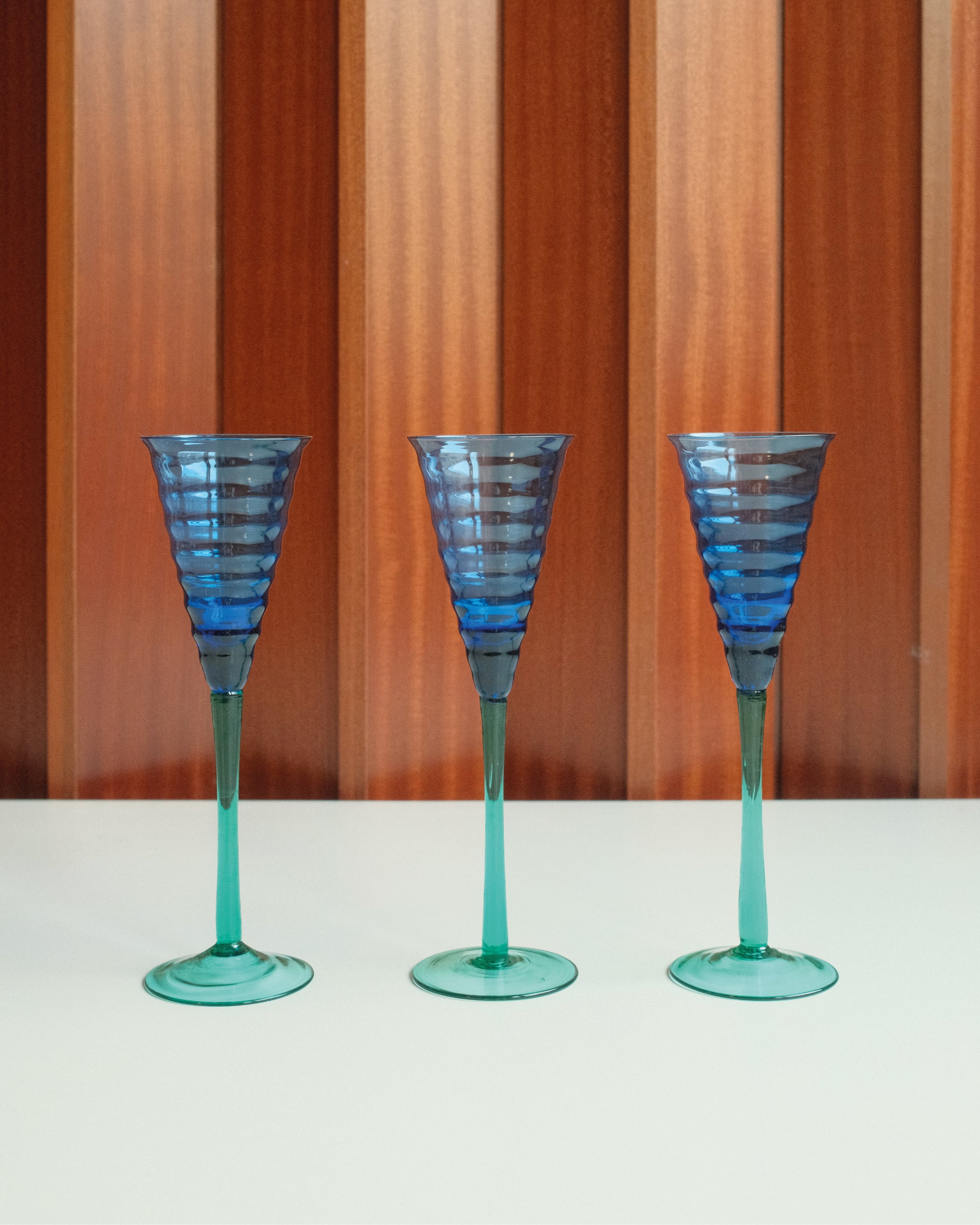 Three glasses in blue and green