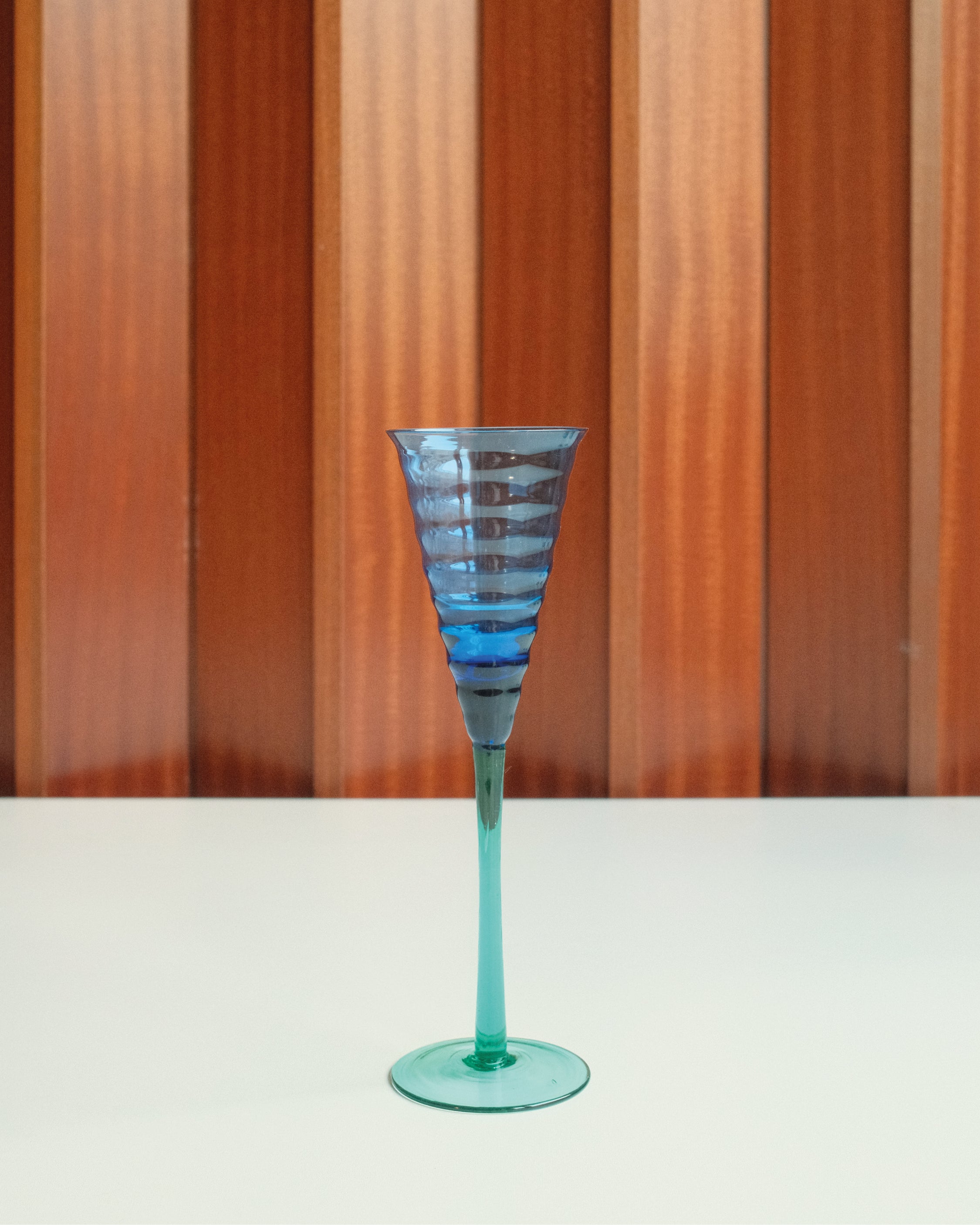 Three glasses in blue and green