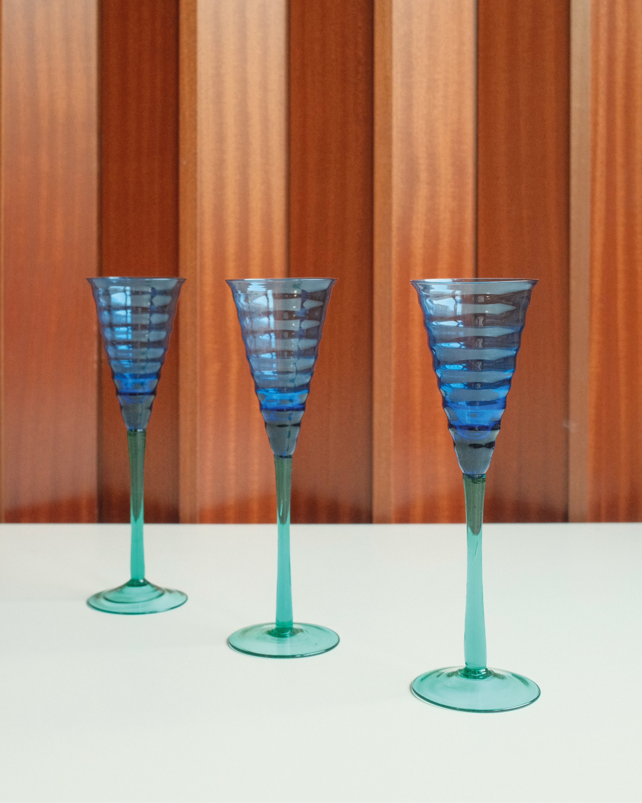Three glasses in blue and green