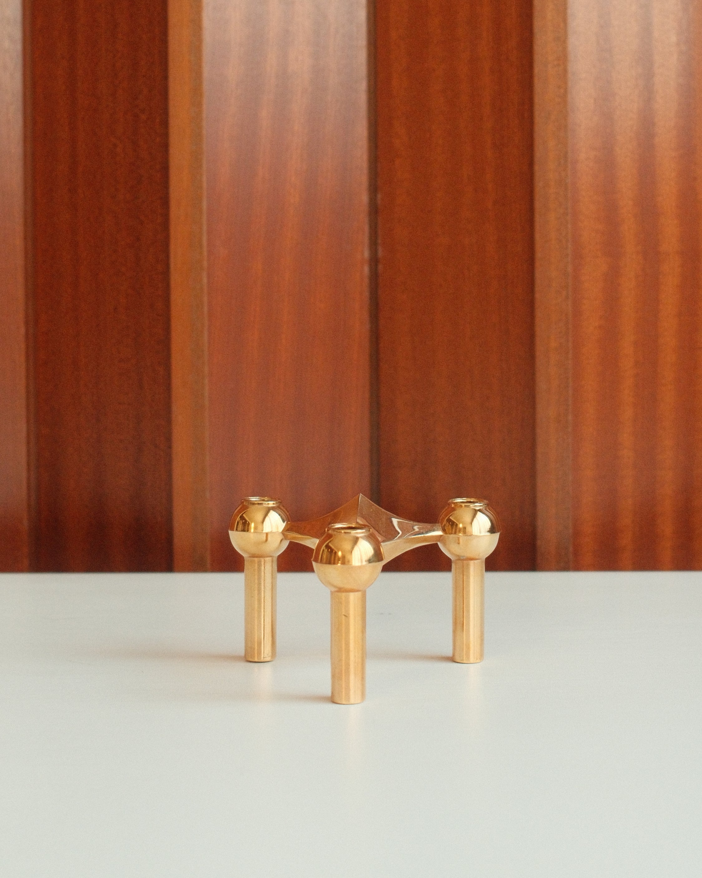 Modular candle holder in solid brass, Stoff Nagel