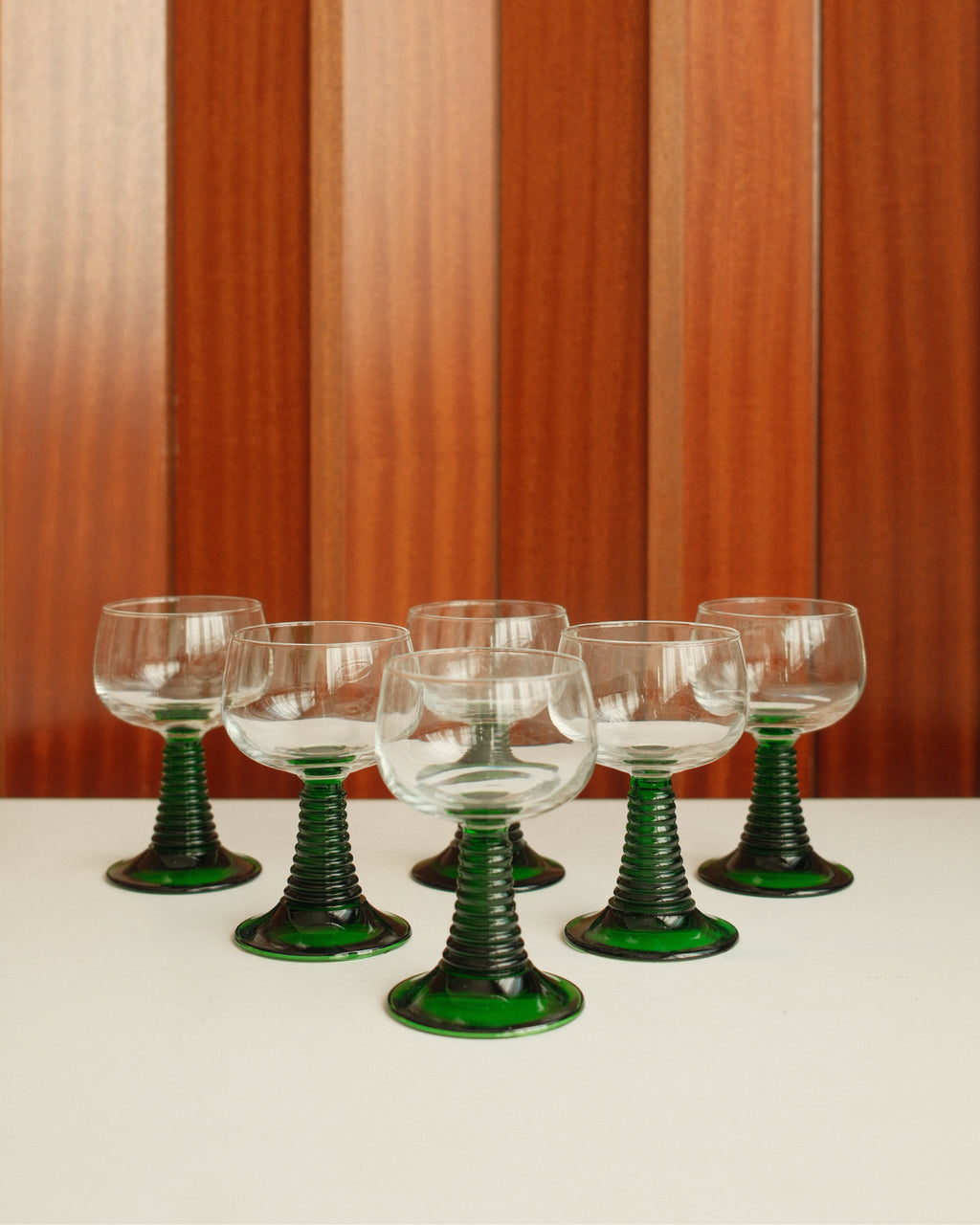 Six small roemer glasses with green stem