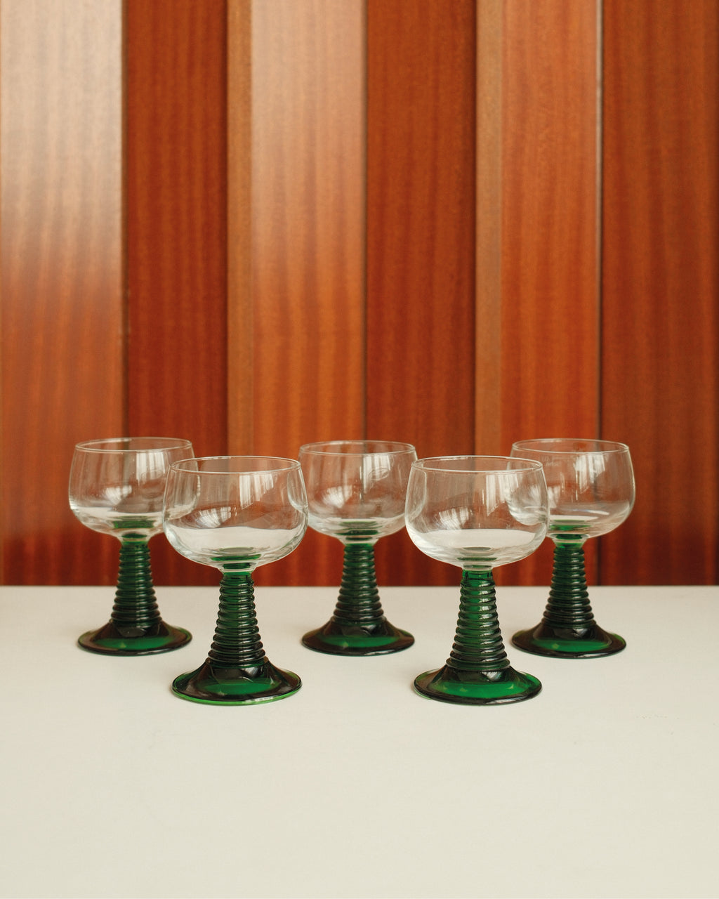 Six small roemer glasses with green stem