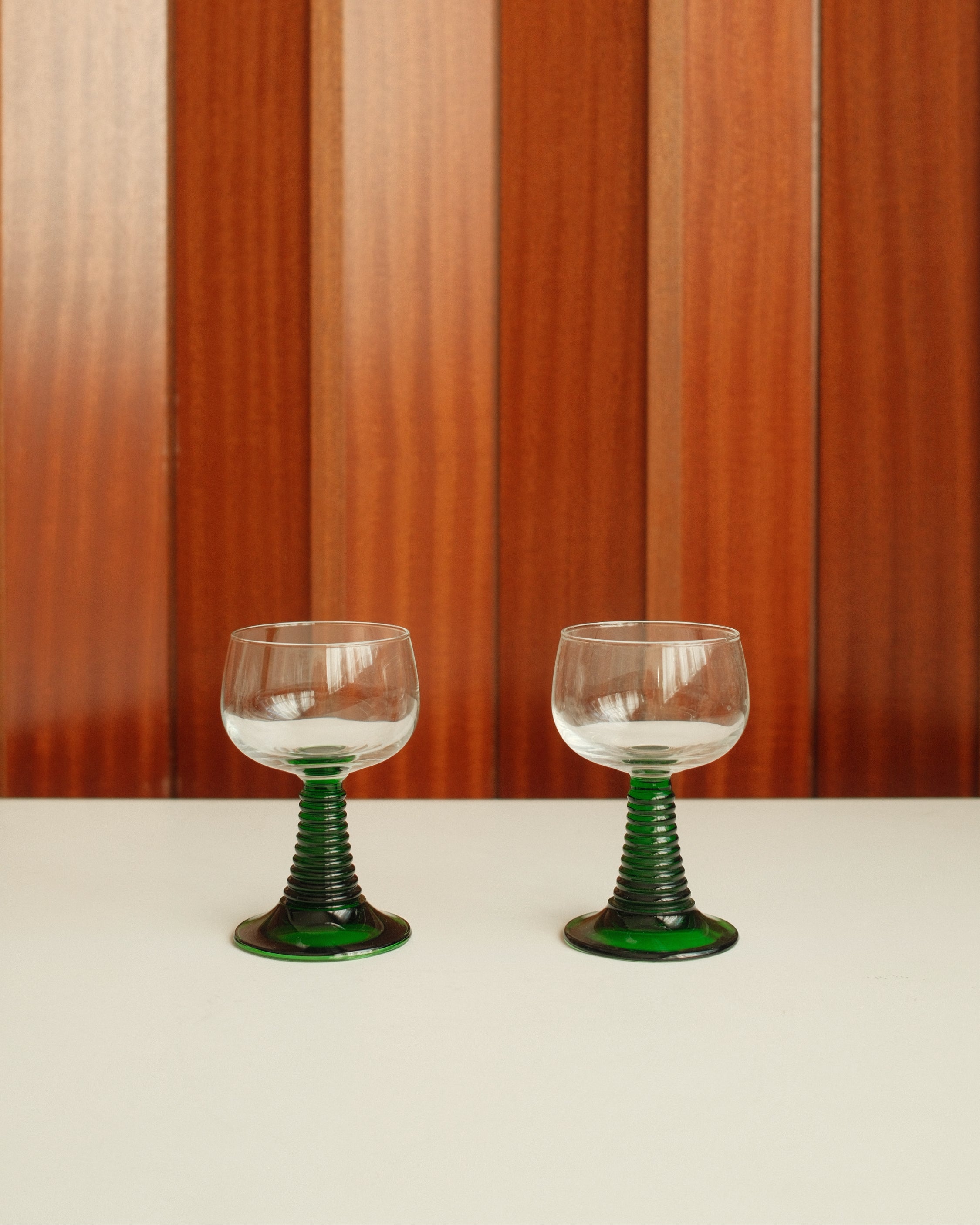 Six small roemer glasses with green stem