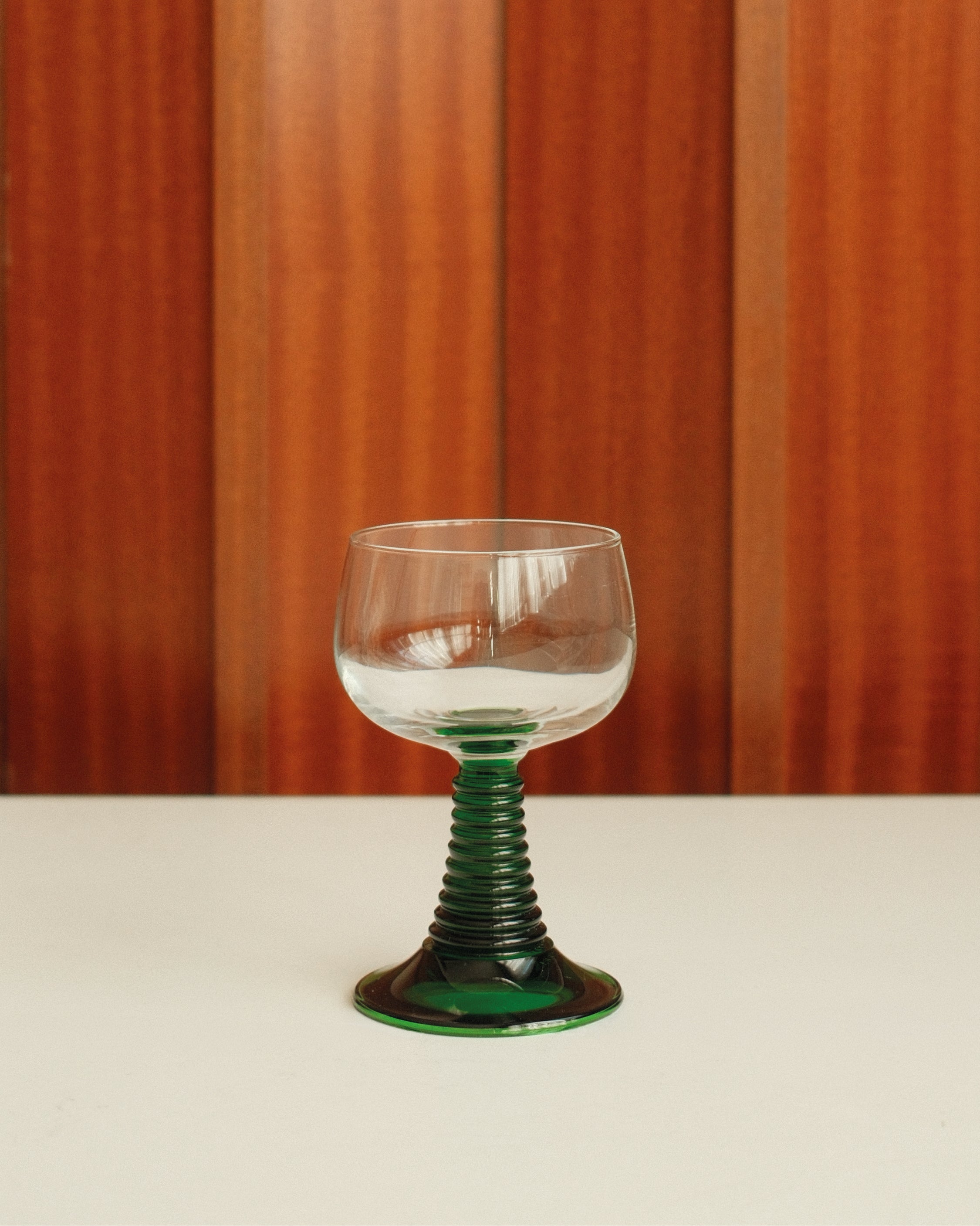 Six small roemer glasses with green stem