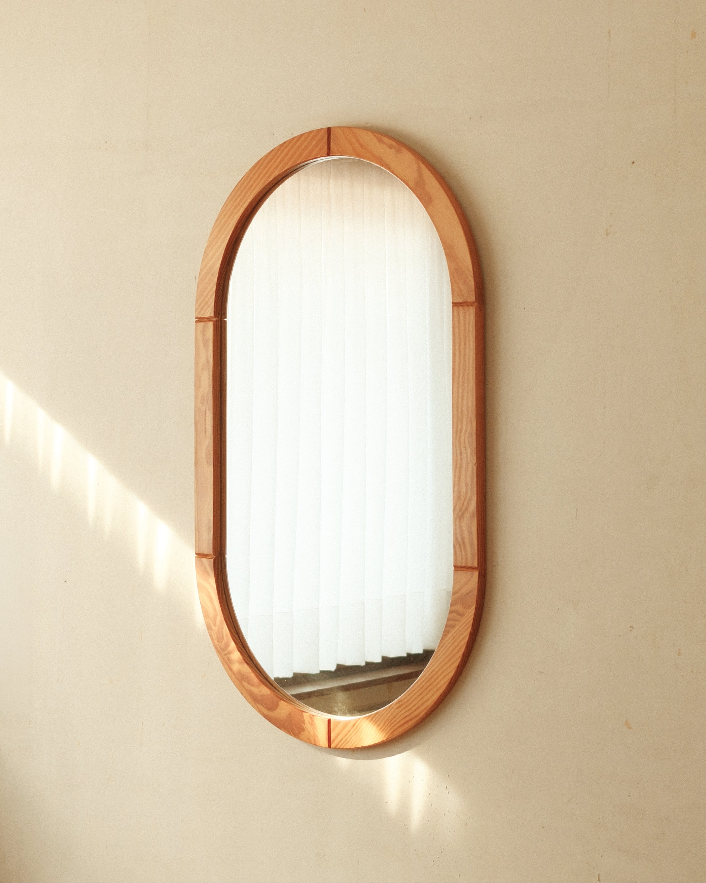Rounded pine mirror