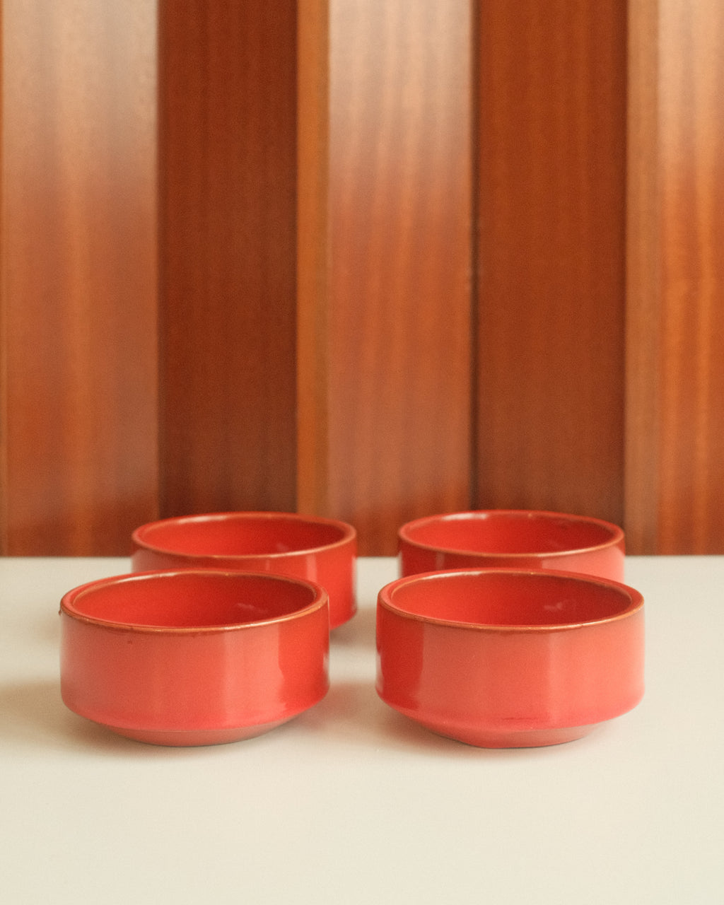 Set of four red ceramic bowls